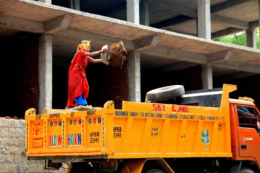 Woman construction worker at McLeod Ganj, Dharamsala, India