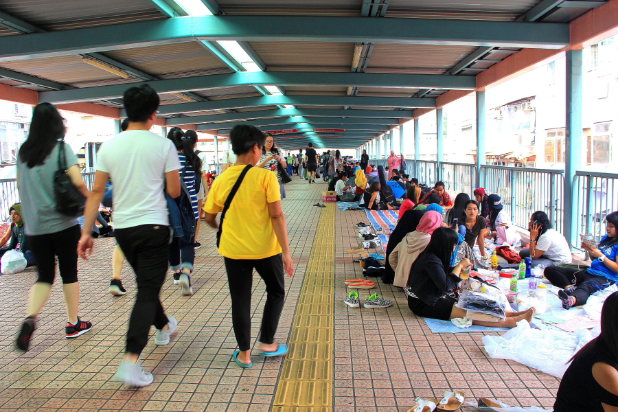 Pedestrian bridge filled with Indonesian women, at Mongkok, Hong Kong