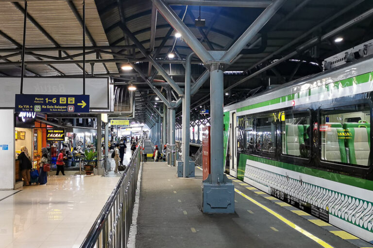 Commuterline train passing through Yogyakarta city skyline