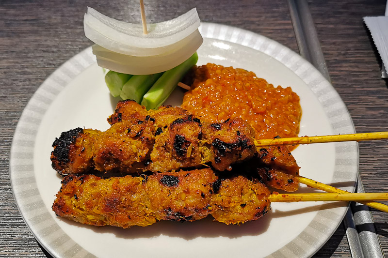 Canape: Singapore Chicken Satay with onion, cucumber and spicy peanut sauce