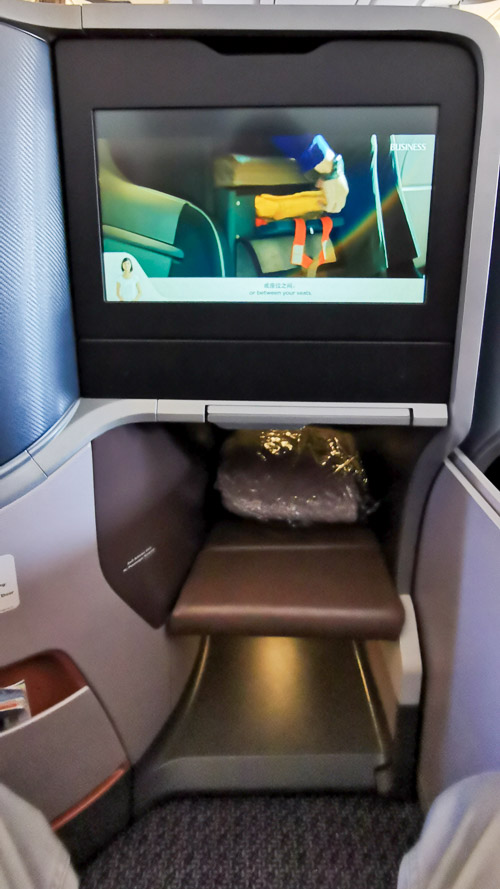 In flight entertainment screen, leg room, and hand-carry storage at Singapore Airlines A350 Business Class